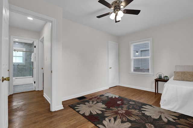 2217 Grasmere Ave, Columbus, OH 43211 - bedroom with baseboards, wood finished floors, and ceiling fan