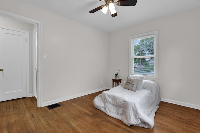 2217 Grasmere Ave, Columbus, OH 43211 - bedroom featuring baseboards, wood finished floors, and ceiling fan