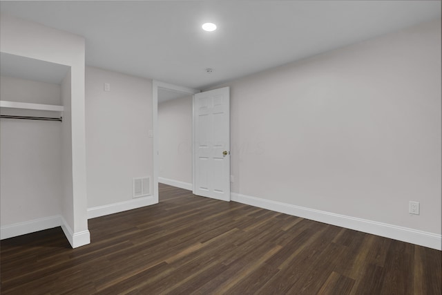 2217 Grasmere Ave, Columbus, OH 43211 - unfurnished bedroom with baseboards, dark wood-style floors, and a closet