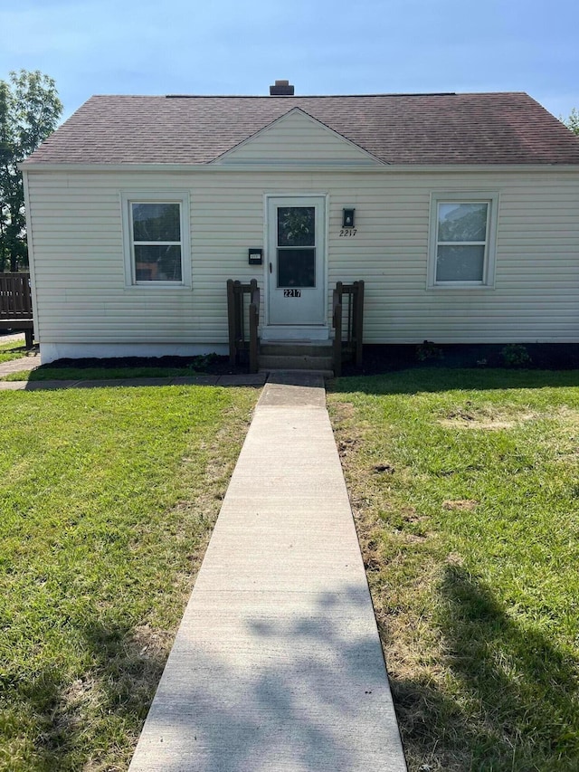 2217 Grasmere Ave, Columbus, OH 43211 - view of front of house with roof with shingles and a front yard