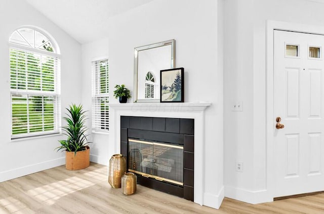 560 Dandy Brush Ln E, Columbus, OH 43230 - detailed view of wood finished floors, a tile fireplace, and baseboards