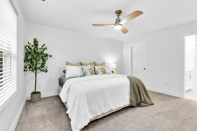 560 Dandy Brush Ln E, Columbus, OH 43230 - bedroom with carpet flooring, multiple windows, baseboards, and ensuite bathroom