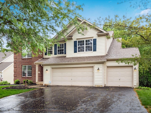 7034 Kellogg Dr, Powell, OH 43065 - view of front of house with asphalt driveway, an attached garage, and a shingled roof