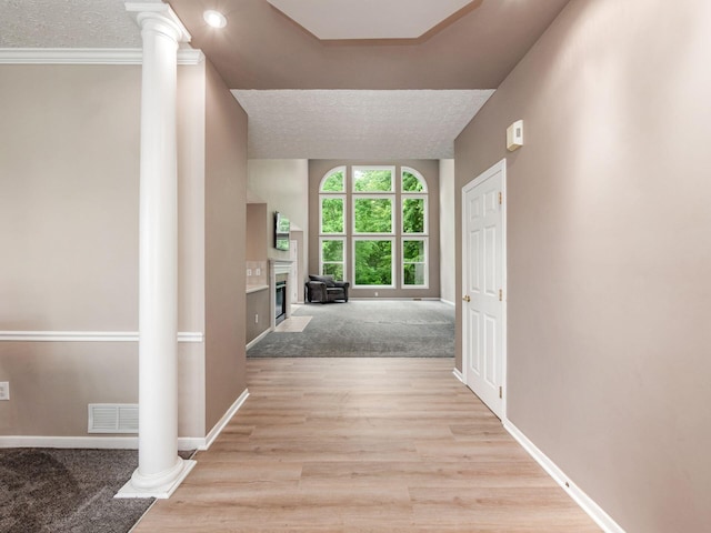 7034 Kellogg Dr, Powell, OH 43065 - hall featuring ornate columns, baseboards, and light wood-type flooring