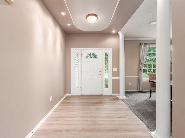 7034 Kellogg Dr, Powell, OH 43065 - entrance foyer featuring ornate columns, recessed lighting, baseboards, and light wood-style floors