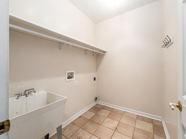 7034 Kellogg Dr, Powell, OH 43065 - laundry room with hookup for an electric dryer, washer hookup, baseboards, and a textured ceiling