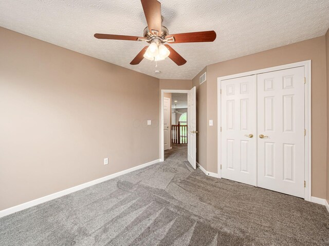 7034 Kellogg Dr, Powell, OH 43065 - unfurnished bedroom featuring carpet flooring, baseboards, a closet, a textured ceiling, and ceiling fan