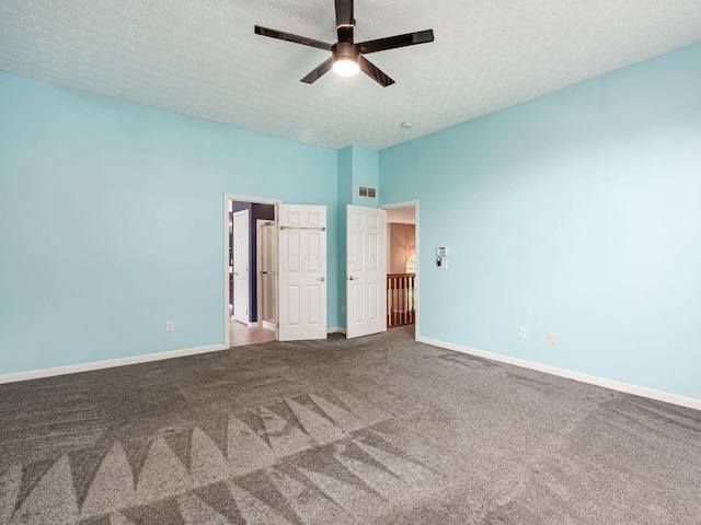 7034 Kellogg Dr, Powell, OH 43065 - unfurnished bedroom featuring carpet flooring, baseboards, a textured ceiling, and ceiling fan