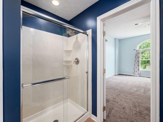 7034 Kellogg Dr, Powell, OH 43065 - bathroom with a textured ceiling, a stall shower, and baseboards