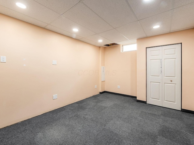 7034 Kellogg Dr, Powell, OH 43065 - below grade area with recessed lighting, dark colored carpet, and a drop ceiling
