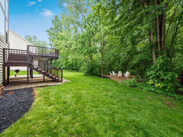 7034 Kellogg Dr, Powell, OH 43065 - view of grassy yard featuring stairs and a deck