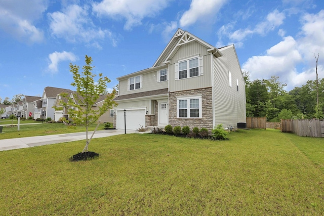 1137 Legacy Ln, Pataskala, OH 43062 - view of front of home with stone siding, driveway, an attached garage, board and batten siding, and central AC