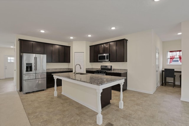 1137 Legacy Ln, Pataskala, OH 43062 - kitchen with appliances with stainless steel finishes, a sink, light stone countertops, a breakfast bar area, and recessed lighting
