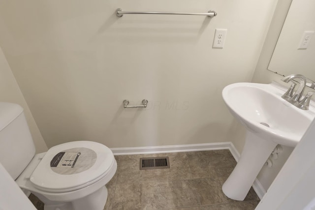 1137 Legacy Ln, Pataskala, OH 43062 - half bathroom with toilet and baseboards
