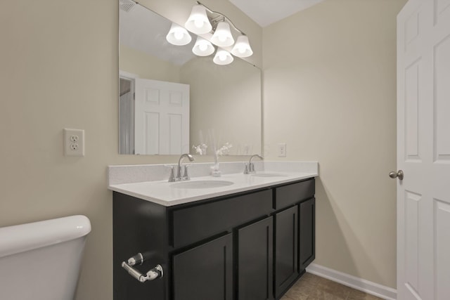 1137 Legacy Ln, Pataskala, OH 43062 - bathroom featuring double vanity, toilet, tile patterned flooring, and baseboards