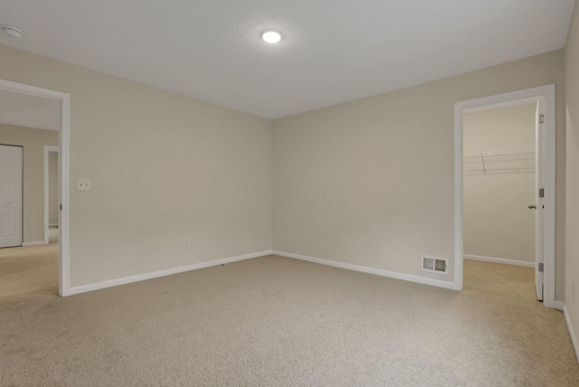 1137 Legacy Ln, Pataskala, OH 43062 - empty room with light colored carpet, baseboards, and a smoke detector