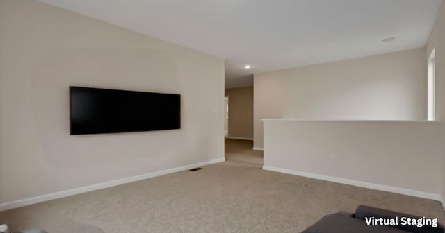 1137 Legacy Ln, Pataskala, OH 43062 - unfurnished living room with carpet floors, baseboards, and recessed lighting