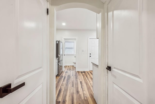 1113-1115 S Ohio Ave, Columbus, OH 43206 - hall with light wood-style flooring, arched walkways, recessed lighting, and baseboards