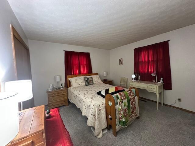 14572 Hock Hocking Rd, Logan, OH 43138 - carpeted bedroom with a textured ceiling and baseboards