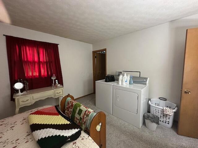 14572 Hock Hocking Rd, Logan, OH 43138 - laundry room with independent washer and dryer, carpet, and a textured ceiling
