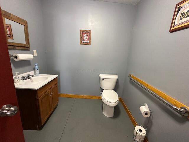 14572 Hock Hocking Rd, Logan, OH 43138 - half bathroom featuring toilet and vanity