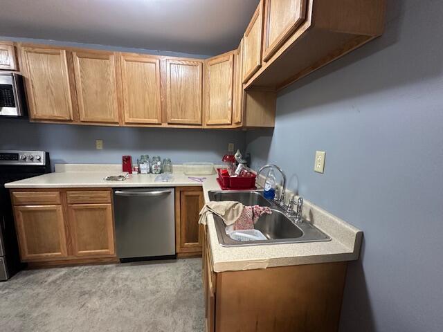 14572 Hock Hocking Rd, Logan, OH 43138 - kitchen featuring appliances with stainless steel finishes, light countertops, and light colored carpet