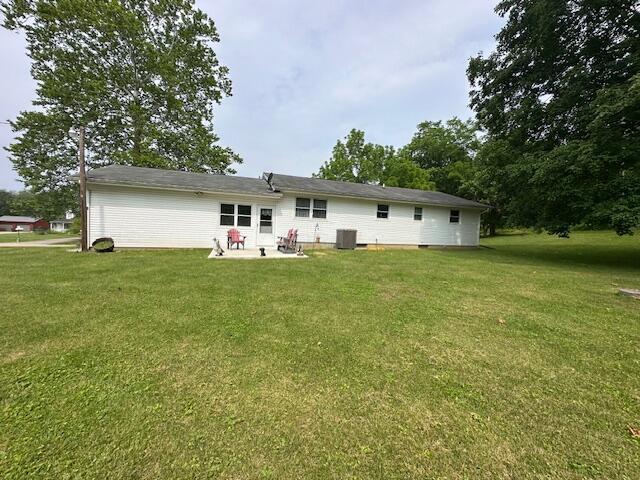 14572 Hock Hocking Rd, Logan, OH 43138 - back of property with a yard and a patio area