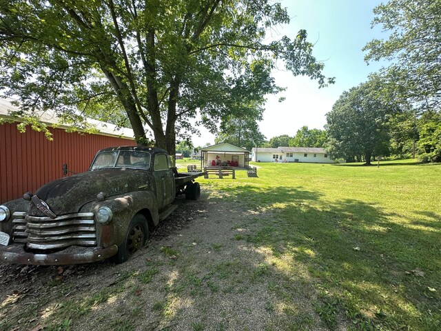 14572 Hock Hocking Rd, Logan, OH 43138 - view of green lawn featuring an outdoor structure and a pole building