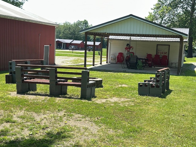 14572 Hock Hocking Rd, Logan, OH 43138 - view of grassy yard featuring a pole building and an outdoor structure