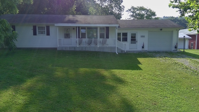 14572 Hock Hocking Rd, Logan, OH 43138 - ranch-style home with covered porch, dirt driveway, an attached garage, and a front yard