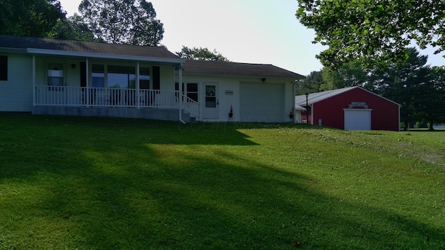 14572 Hock Hocking Rd, Logan, OH 43138 - back of property with covered porch, a lawn, and an attached garage