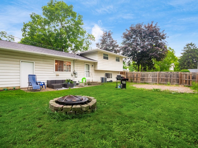 334 Wittenberg St, Columbus, OH 43230 - rear view of property with a fire pit and central air condition unit