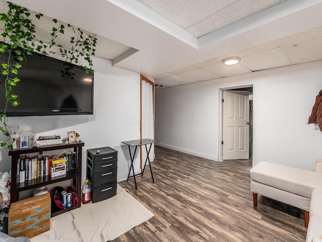 334 Wittenberg St, Columbus, OH 43230 - living area with a drop ceiling, wood finished floors, and baseboards
