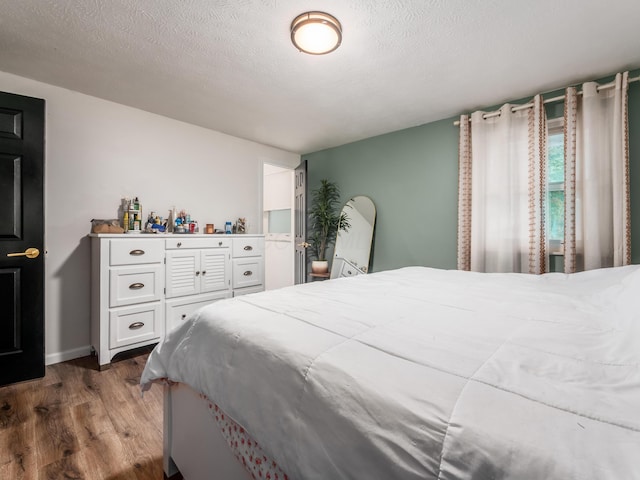 334 Wittenberg St, Columbus, OH 43230 - bedroom featuring wood finished floors and a textured ceiling