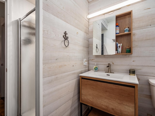 334 Wittenberg St, Columbus, OH 43230 - bathroom featuring wooden walls, vanity, toilet, and a shower stall
