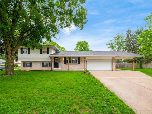 334 Wittenberg St, Columbus, OH 43230 - split level home with a garage, brick siding, and concrete driveway