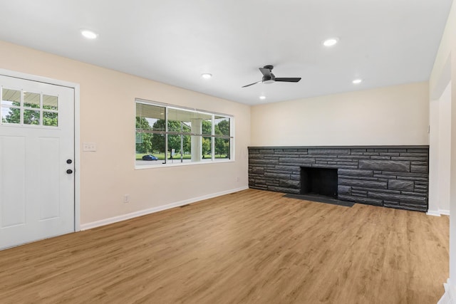 1345 E Deshler Ave, Columbus, OH 43206 - unfurnished living room featuring baseboards, healthy amount of natural light, light wood finished floors, and recessed lighting