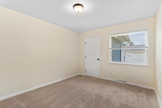 1345 E Deshler Ave, Columbus, OH 43206 - carpeted empty room featuring baseboards