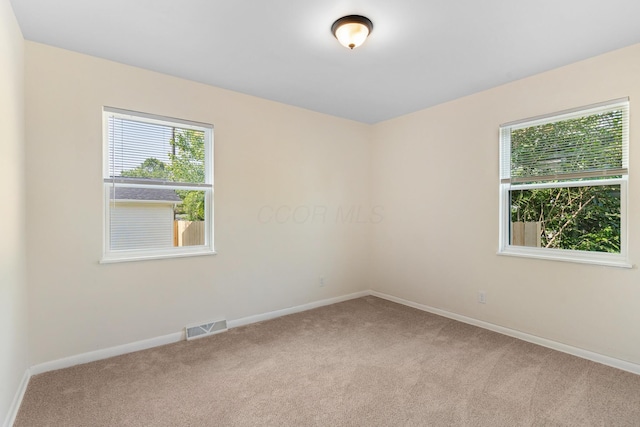 1345 E Deshler Ave, Columbus, OH 43206 - spare room featuring light carpet and baseboards