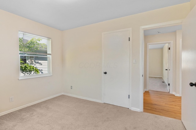 1345 E Deshler Ave, Columbus, OH 43206 - unfurnished bedroom featuring carpet and baseboards