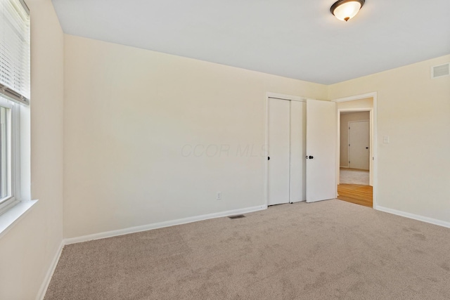 1345 E Deshler Ave, Columbus, OH 43206 - empty room featuring carpet and baseboards