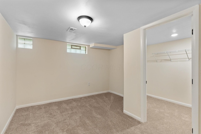 1345 E Deshler Ave, Columbus, OH 43206 - below grade area with carpet flooring, baseboards, and plenty of natural light