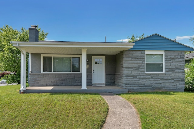 1345 E Deshler Ave, Columbus, OH 43206 - ranch-style house with stone siding, covered porch, a front lawn, and a chimney