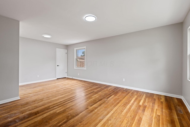1001 S Harris Ave, Columbus, OH 43204 - spare room featuring baseboards and light wood-type flooring