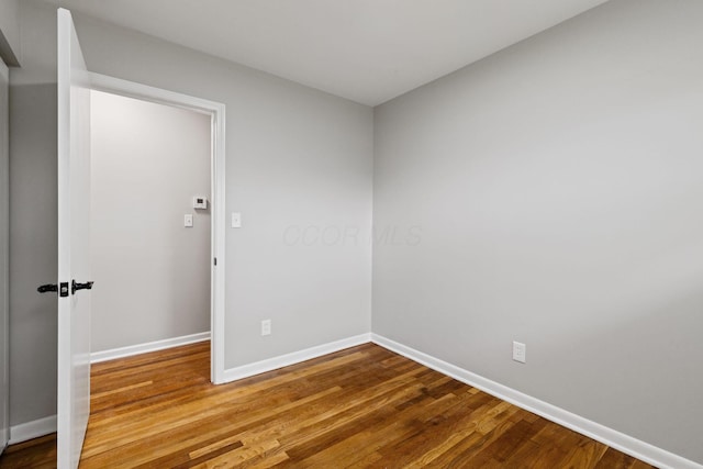 1001 S Harris Ave, Columbus, OH 43204 - unfurnished room with baseboards and wood finished floors