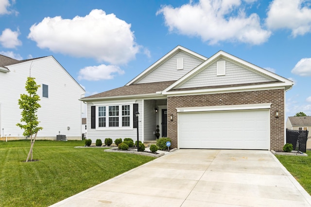 1333 Andy Way, Pataskala, OH 43062 - view of front of property with a front lawn, concrete driveway, brick siding, and a garage