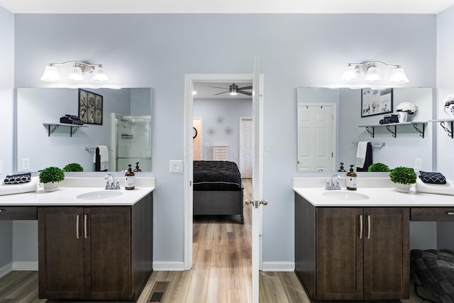 1333 Andy Way, Pataskala, OH 43062 - ensuite bathroom featuring wood finished floors, two vanities, a ceiling fan, and a shower
