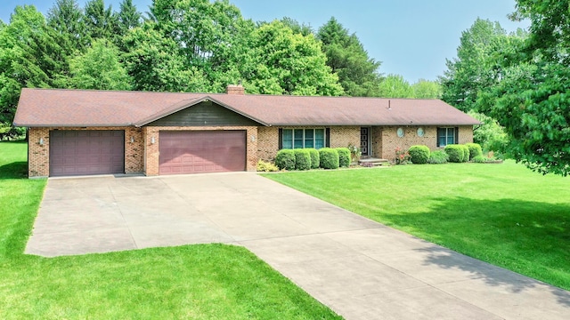 20 Snider Rd, New Carlisle, OH 45344 - ranch-style house featuring a garage, driveway, a front lawn, and a chimney