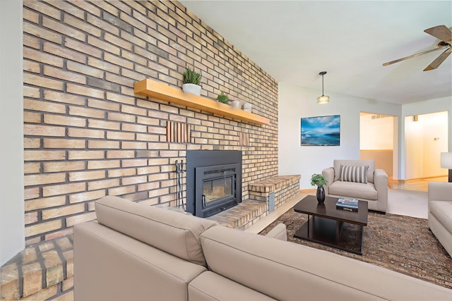 20 Snider Rd, New Carlisle, OH 45344 - living room featuring a ceiling fan, a brick fireplace, and brick wall