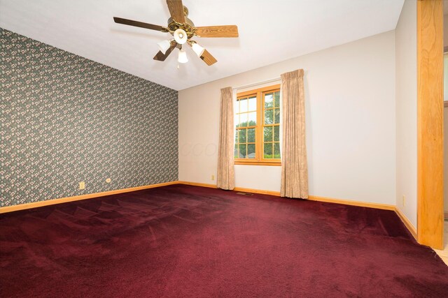 20 Snider Rd, New Carlisle, OH 45344 - empty room featuring an accent wall, wallpapered walls, baseboards, and carpet